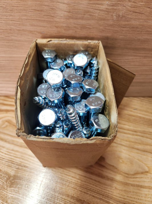 Box of screws on a wooden surface