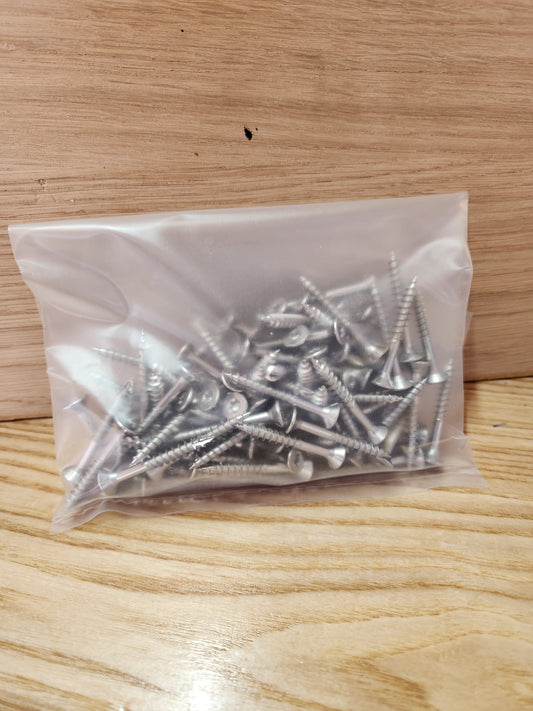 Bag of screws on a wooden surface