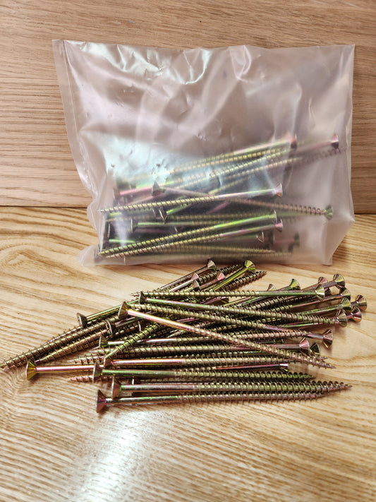 Bags of screws on a wooden surface