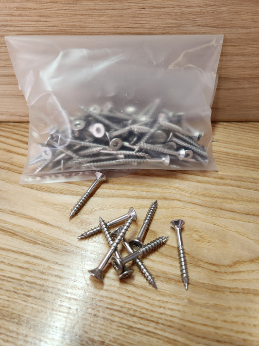 Bag of screws on a wooden surface